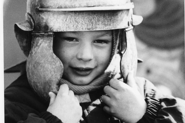 Philip Collinson, 4, tries on one of the helmets at Arbeia in this 1990 scene.
