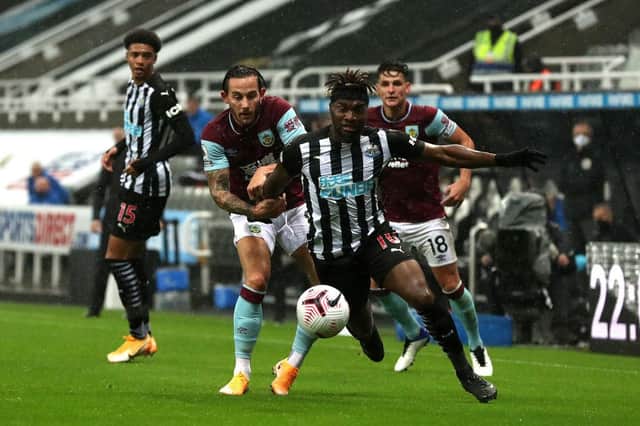 Allan Saint-Maximin of Newcastle United is challenged by Josh Brownhill of Burnley and Ashley Westwood.