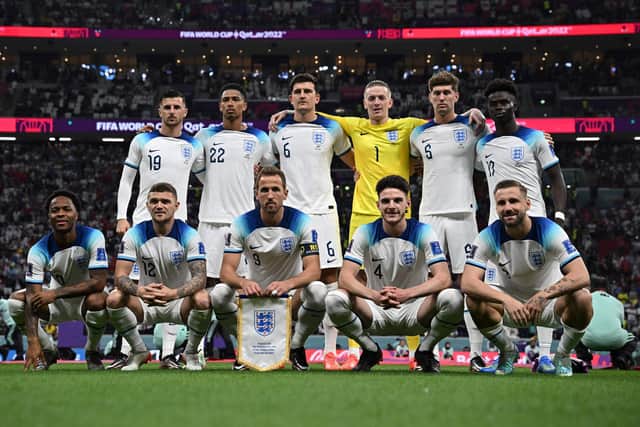 (From top L) England's midfielder #19 Mason Mount, England's midfielder #22 Jude Bellingham, England's defender #06 Harry Maguire, England's goalkeeper #01 Jordan Pickford, England's defender #05 John Stones and England's forward #17 Bukayo Saka, (bottom fromL) England's forward #10 Raheem Sterling, England's defender #12 Kieran Trippier, England's forward #09 Harry Kane, England's midfielder #04 Declan Rice and England's defender #03 Luke Shaw pose ahead of the Qatar 2022 World Cup Group B football match between England and USA at the Al-Bayt Stadium in Al Khor: Paul ELLIS / AFP) (Photo by PAUL ELLIS/AFP via Getty Images