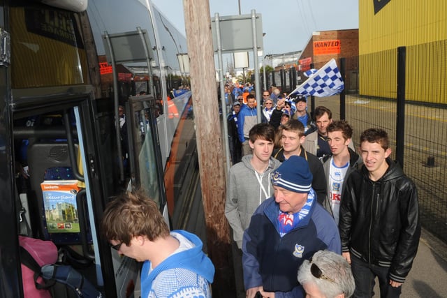 Fans board their buses for Wembley at Fratton Park.