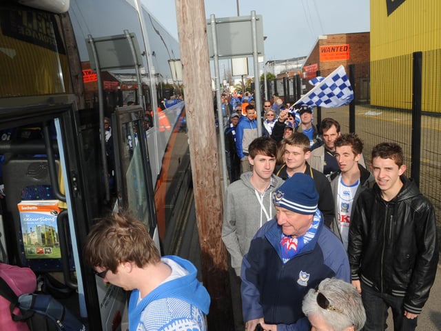 Fans board their buses for Wembley at Fratton Park.