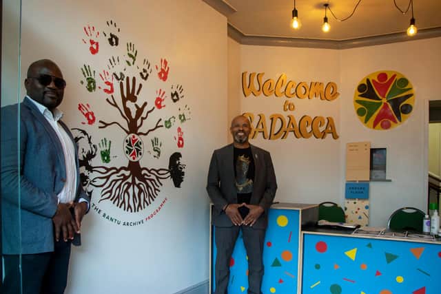 Olivier Tsemo and Robert Cotterell pictured beside the Bantu Archive Programme mural.