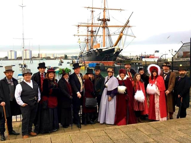 Costumed revellers pose for a photo as they attend the Victorian Festival of Christmas at Portsmouth Historic Dockyard - just one of the many local events we can't wait to return when it's safe.