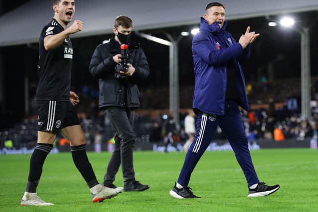 Sheffield United manager Paul Heckingbottom and John Egan celebrate the win over Fulham in west London: David Klein / Sportimage