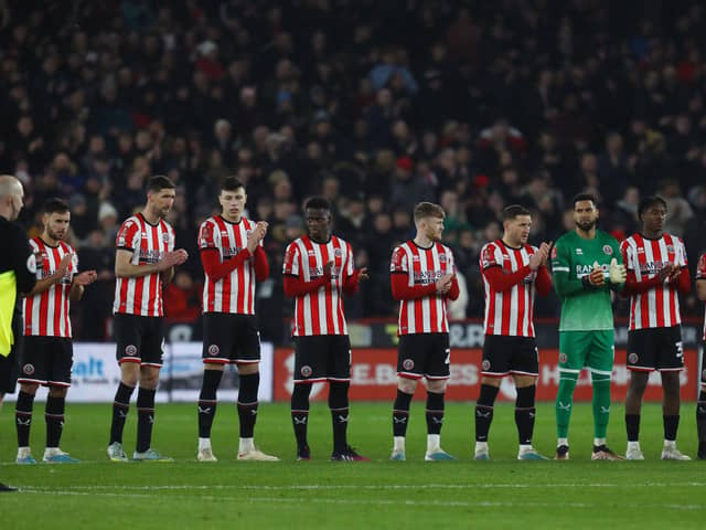 Sheffield United players take part in a minute's applause in memory of John Motson: Paul Thomas / Sportimage