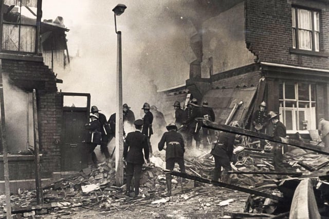 Firemen working on the debris ot two houses after an explosion in Canada Street, Pitsmoor, Sheffield, May 21, 1968