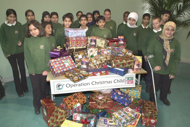 Pictured at Fir Vale School, Owler Lane, Sheffield, where staff and, pupils collected a record number of shoe boxes for the Christmas appeal operation Christmas Child in 2001. Seen  are some of the pupils with a selection of boxes.