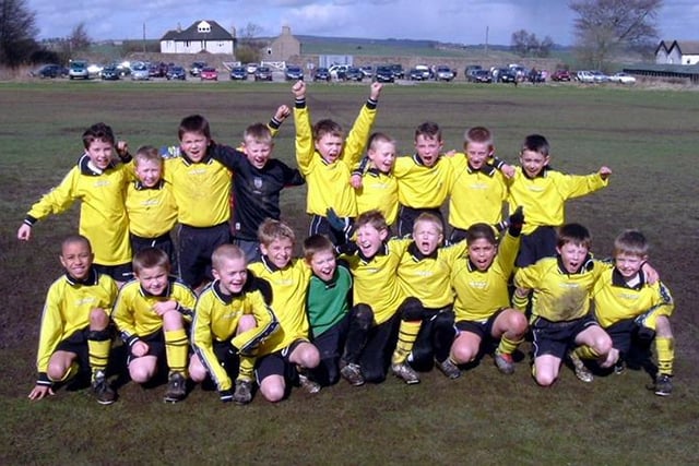 Hallam Rangers under-9s football team celebrate after winning the Sheffield and District Junior Sunday League, March 2004.  Picture submitted Alan Tenanty
