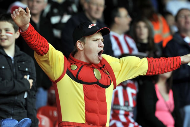 A fan in costume gives the Blades his backing at Palace