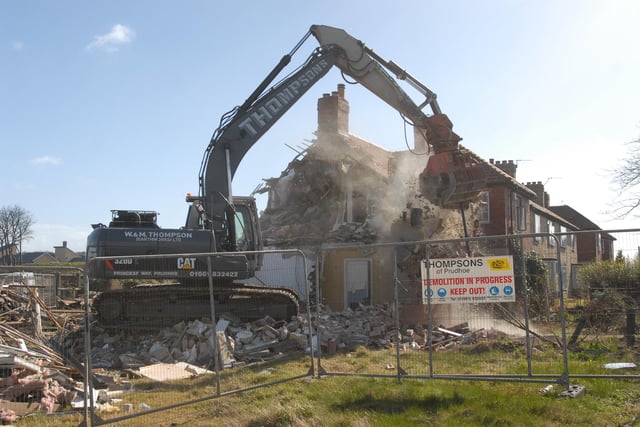 The  demolition of properties on King George Road 14 years ago.