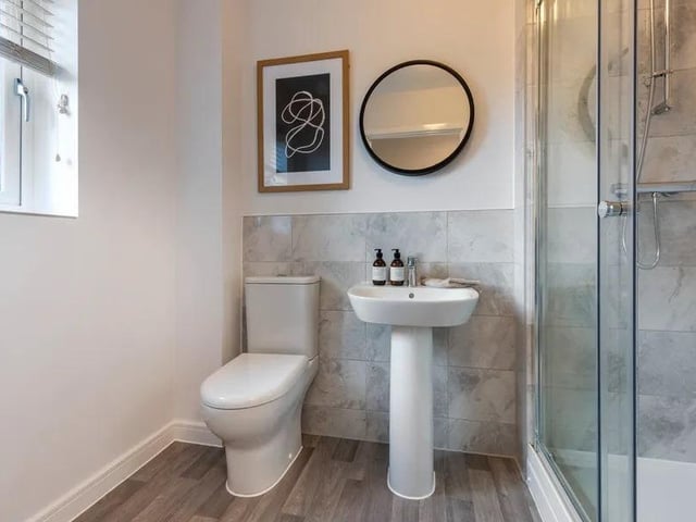 This shower en-suite is accessed through the master bedroom.
