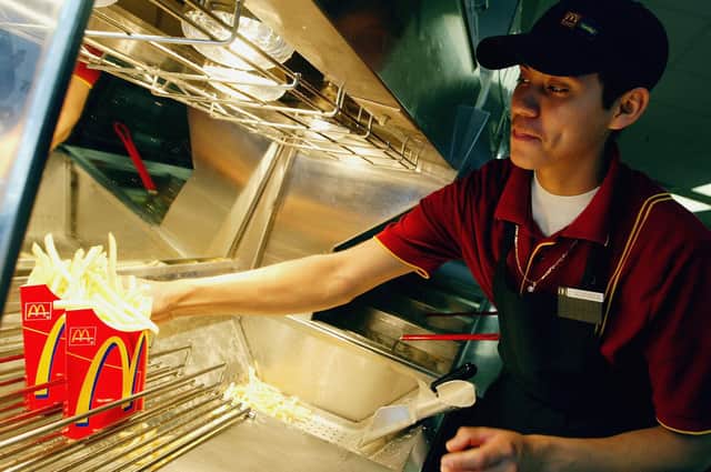 A staff member at the french fry counter in a McDonald's restaurant. Picture: Justin Sullivan/Getty Images.