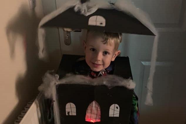 Four-year-old Grayson wanted to be a haunted house, so they got creative with paint and cardboard boxes.
What a great idea!