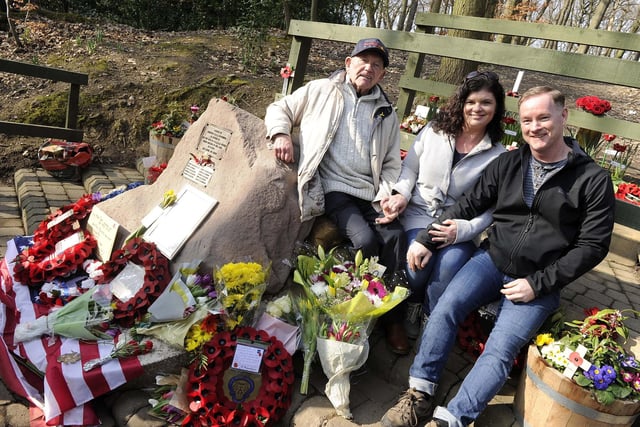 Tony Foulds sat on his beloved memorial during the 2019 flypast with visitors from New York, Steven and Tina Bartlett.