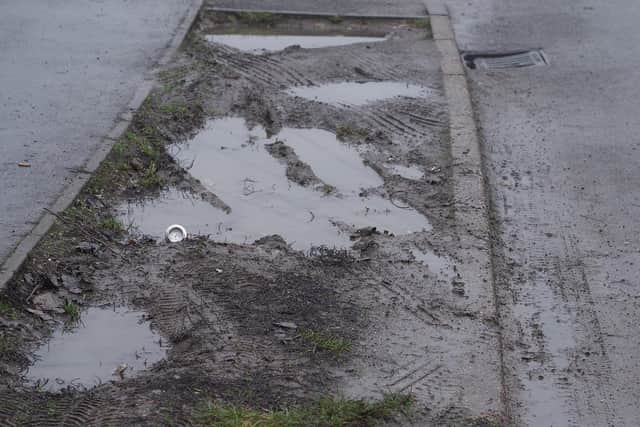 Simon Dell has been told to remove stones placed on grass verges in Hackenthorpe, Sheffield, to stop cars churning them into mud