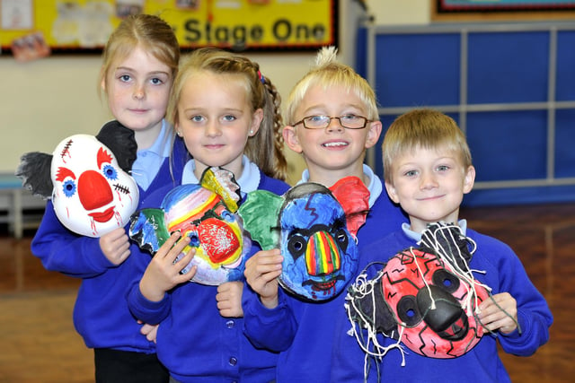 Pupils from Amble Links with their Halloween masks in 2011.
