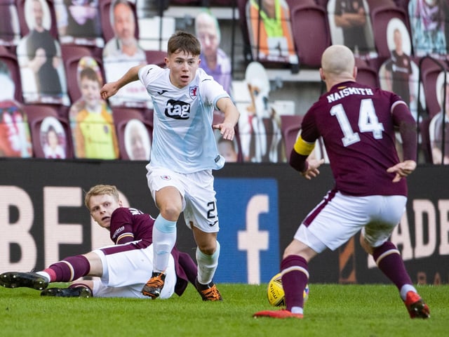 Raith debutant Kai Kennedy takes on Hearts captain Steven Naismith.