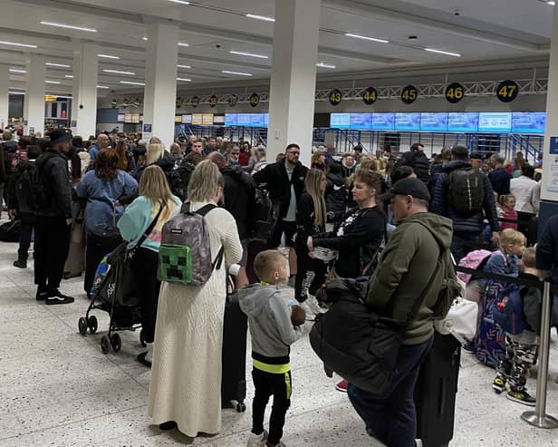 Passengers queue inside the departures area of Terminal 1 at Manchester Airport, as the Easter getaway starts (pic: Peter Byrne/PA Wire)