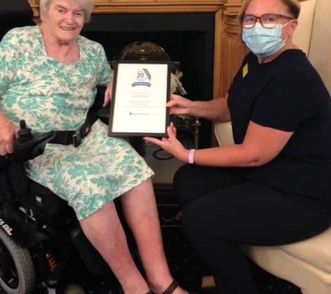 Staff and residents at Henleigh Hall Care Home celebrate the award