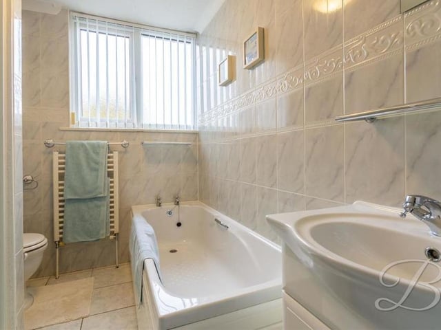 The bathroom is flexible because not only does it boast a bath, wash basin with storage and low-flush WC, there is also a walk-in shower, plus a heated towel-rail.