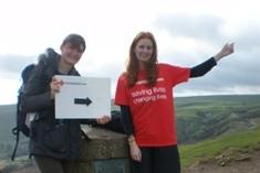 Community fundraisers Alex Gadsby (left) and Jackie Pickersgill (right) show walkers the way from the top of Mam Tor in 2012