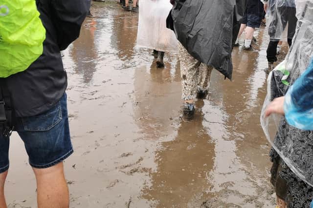 Tramlines festival-goers braving the rain and mud in Hillsborough Park, Sheffield on Sunday, July 23, 2023. Picture: Julia Armstrong, LDRS