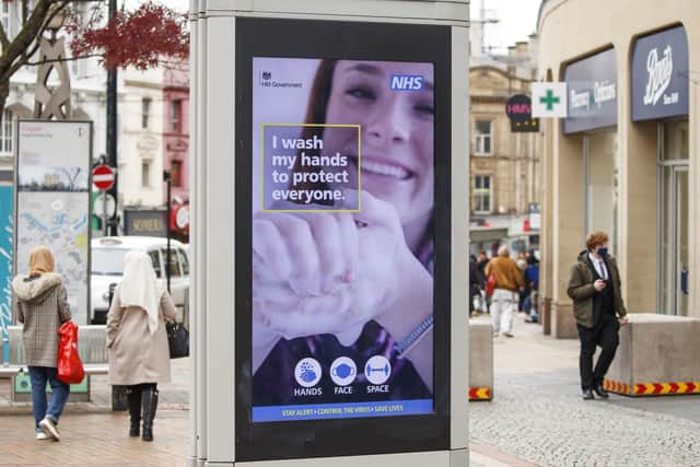 A government health warning is displayed in Sheffield city centre. Photo: Danny Lawson/PA Wire.