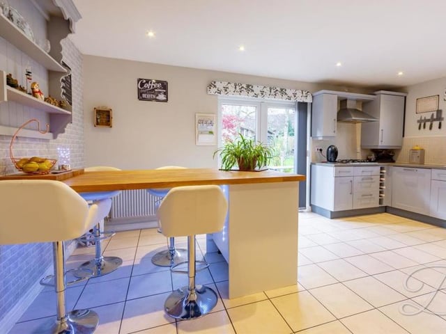 The kitchen is a delightful room in its own right. But it also has French doors leading out to the back garden.