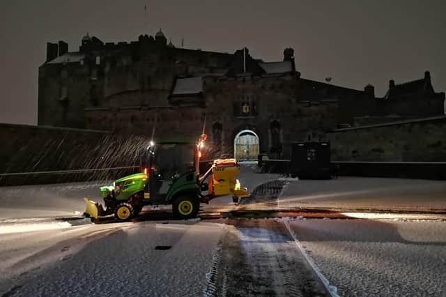 Clearing snow from the  deserted Esplanade at Edinburgh Castle