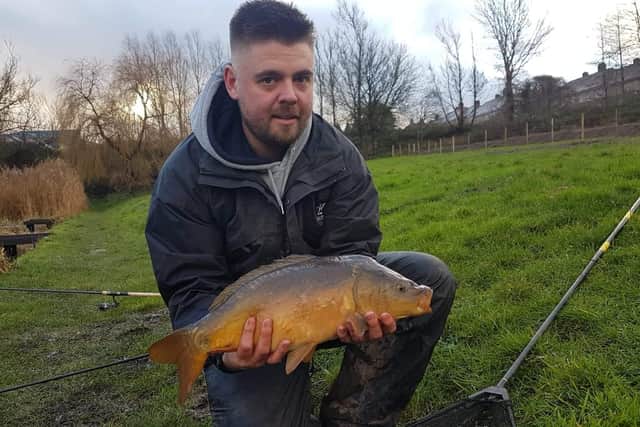 Angler Tom Middleton with the Mirror Carp he caught in Arourthorne Pond