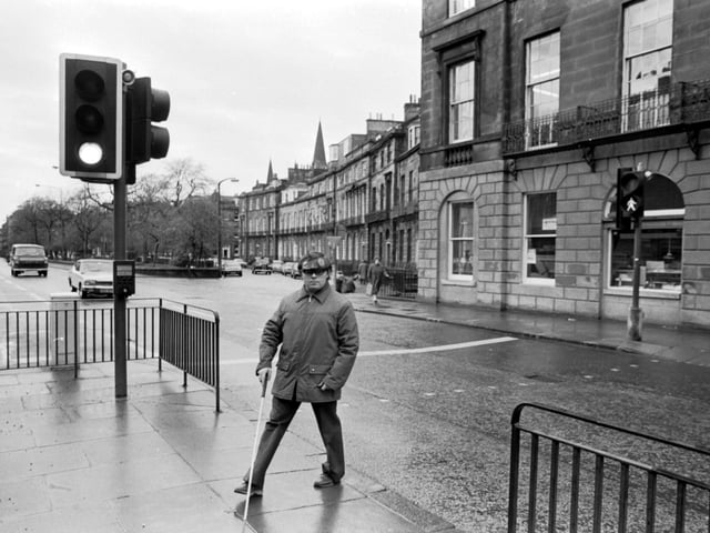 James McCafferty, the Edinburgh secretary of the National League for Blind and Disabled, at Britain's first talking road crossing, installed at Shandwick Place in November 1980.