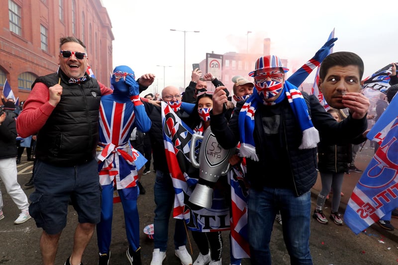 Rangers fans celebrate outside of the Ibrox Stadium after Rangers win the Scottish Premiership title. P