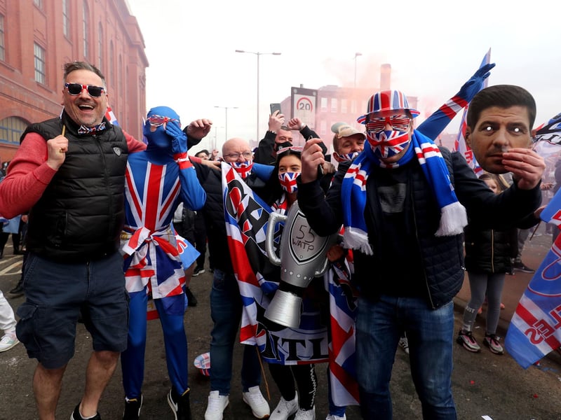 Rangers fans celebrate outside of the Ibrox Stadium after Rangers win the Scottish Premiership title. P