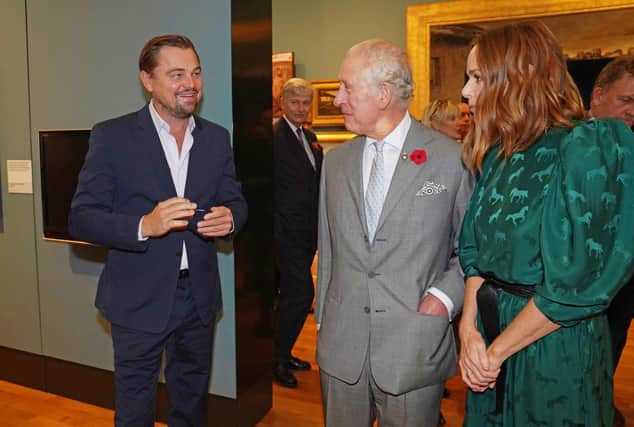 Prince Charles with British designer Stella McCartney and Leonardo DiCaprio.