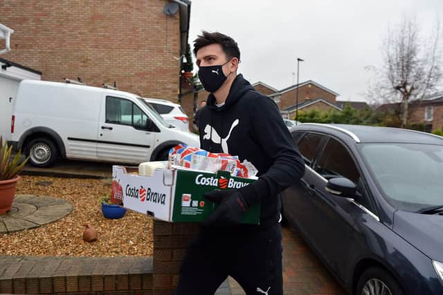 Footballer Harry Maguire hands out food parcels in Mosborough. 