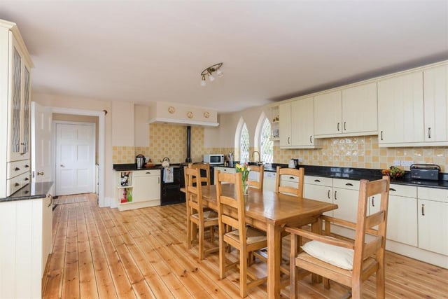 The kitchen is modern with a slightly rustic feel, and fitted with cream units, granite work surfaces as well as a fitted aga and a built-in pantry.