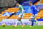 Mohamed  Elyounoussi of Celtic takes on Jamie McCart of St. Johnstone (Mark Runnacles/Getty Images)
