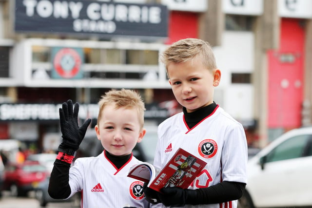 Young supporters take a break from Christmas celebrations to watch United take on Watford at Bramall Lane on Boxing Day last year.