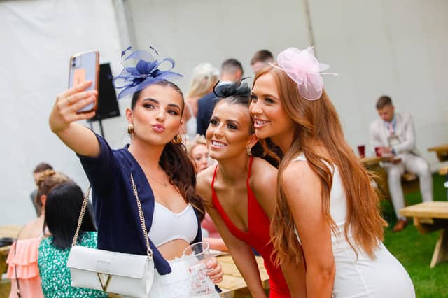 Friends Jenna, Roxane and Ellie capture the day in the first of many selfies