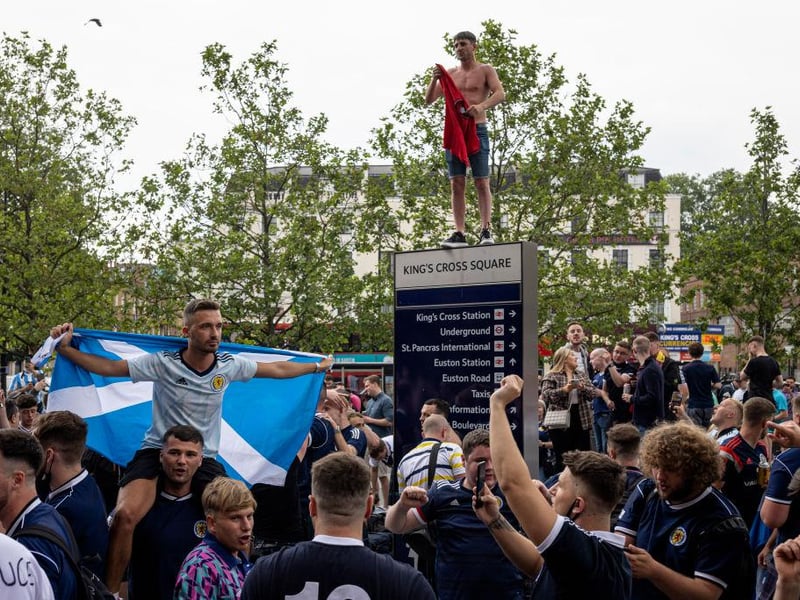 One Scotland supporter enjoyed the 'taps aff' weather as he emerged from Kings Cross station - despite it being a rainy morning in London.