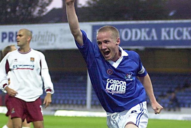 Glynn Hurst runs away with one arm in the air after scoring againsr Northampton Town in August 2002.
