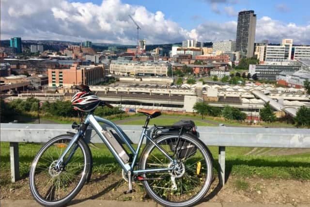 E-bike with Sheffield city skyline in the background.