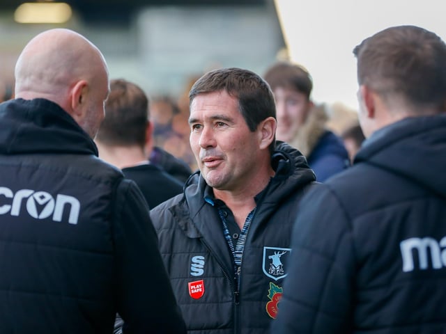 Mansfield Town manager Nigel Clough meets Scunthorpe manager Keith Hill at the start of the game.
