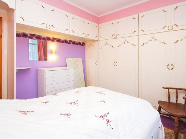 The two bedrooms at the £325,000 bungalow are of a similar size. Here is the main one, which features fitted wardrobes, a radiator and double-glazed windows overlooking the back of the property.