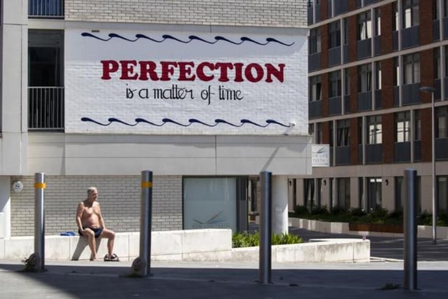A man sunbathes in the good weather in Tollcross. Photo: Jane Barlow/PA Wire
