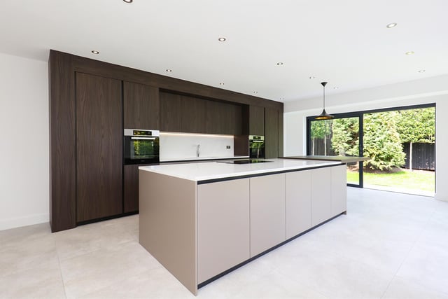 The kitchen is a Karl Benz creation, containing Miele appliances and quartz worktops.