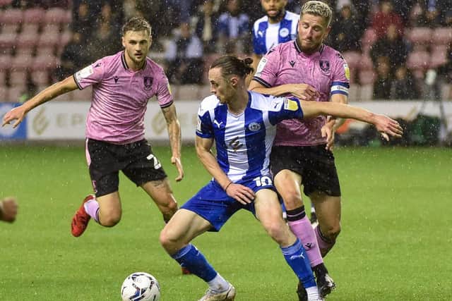 In-form Sheffield Wednesday could move back into the League One play-off places with victory over Wigan Athletic when the promotion-chasers meet at Hillsborough on Tuesday. Photo: Bernard Platt.