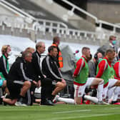 Chris Wilder and his players and staff take a knee: Simon Bellis/Sportimage