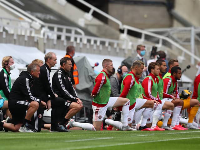 Chris Wilder and his players and staff take a knee: Simon Bellis/Sportimage