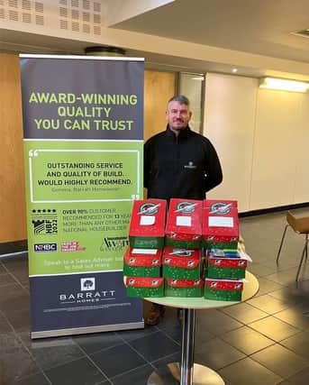 Managing Director Gary Chambers with the shoeboxes